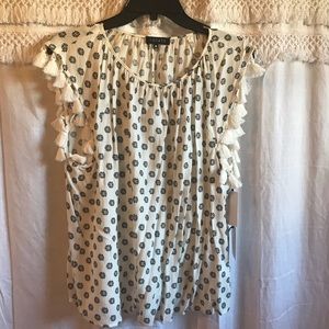 Patterned white shirt with tassel details